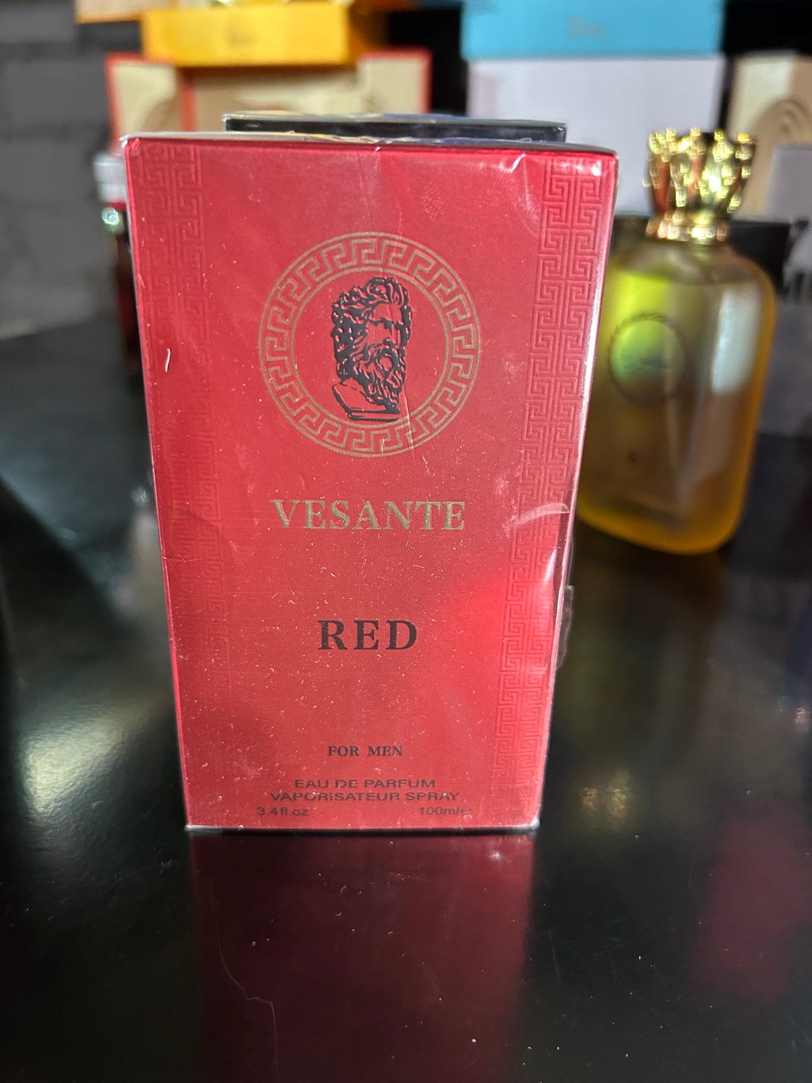 Actual donated Vesante Red for Men box showing bottle artwork